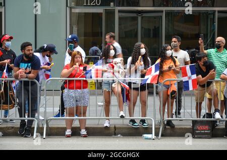 New York, United States. 08th Aug, 2021. Dominican New Yorkers are seen waving flags during the annual Dominican Day Parade along Avenue of the Americas in New York City on August 8, 2021. (Photo by Ryan Rahman/Pacific Press) Credit: Pacific Press Media Production Corp./Alamy Live News