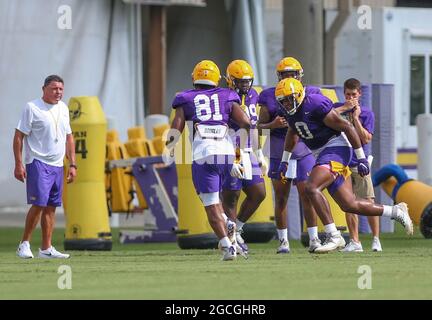 August 8, 2021: LSU defensive lineman Maason Smith (0) works a tackling drill with teammate Bryce Langston (81) as Head Coach Ed Orgeron looks on during the first week of fall football camp at the LSU Charles McClendon Practice Facility in Baton Rouge, LA. Jonathan Mailhes/CSM Stock Photo