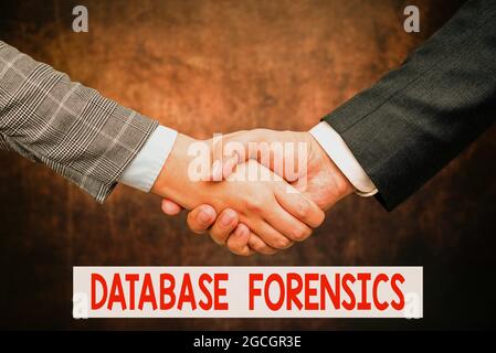Conceptual caption Database Forensics. Business approach identifying transactions within a database system Two Professional Well-Dressed Corporate Stock Photo