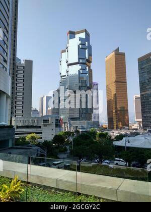 The Lippo Centre in Admiralty, the rich business financial center as seen from the Conrad Hotel with tons of skyscrapers, high rises, and cars Stock Photo