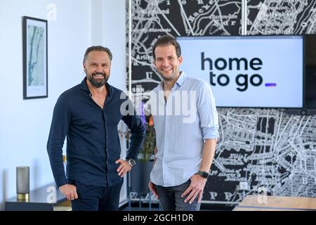 PRODUCTION - 29 July 2021, Berlin: Wolfgang Heigl, Co-Founder and Chief Sales Officer of HomeToGo, and Patrick Andrae, Co-Founder and Managing Director of HomeToGo, during a press event at the company's headquarters in Prenzlauer Berg. HomeToGo is a digital marketplace with what it claims is the world's largest selection of holiday homes and apartments. Founded in 2014, the company currently employs more than 350 people and operates 23 localized apps and websites in Europe, the Americas, Australia and the Asia-Pacific region. Photo: Jens Kalaene/dpa-Zentralbild/ZB Stock Photo
