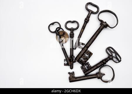 close up of sic old antique keys on white background Stock Photo