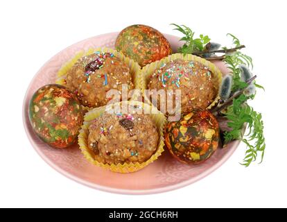 Homemade sweet  Easter  muffins and eggs on pink plate. Isolated on white studio macro shot Stock Photo