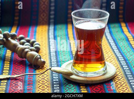 Traditional Turkish tea in a glass on the table. Black hot tea. Istanbul, Turkey Stock Photo
