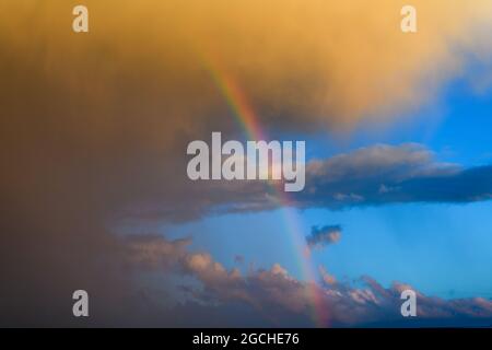 Panorama blue sky and white cloud with sun light and rainbow after rain Stock Photo