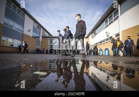 File photo dated 15/03/21 of students arriving at St Andrew's RC Secondary School in Glasgow. Money to recruit up to 1,000 new teachers and 500 teaching assistants has been announced by the Scottish Government. An additional £50 million will be available for teacher recruitment in the coming academic year as schools prepare to return to full-time face-to-face teaching. Issue date: Monday August 9, 2021. Stock Photo