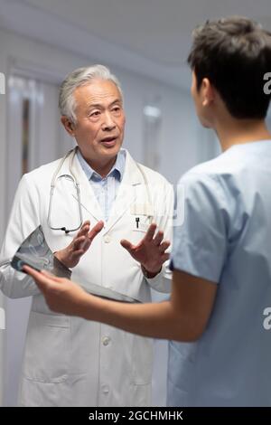 Doctors discussing X-ray image Stock Photo