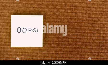 OOPS! Written on sticky notes. Mistake Learning, wrong, blooper, error regret sayings background. Fault, defect, careless lesson correction and reconc Stock Photo