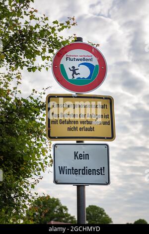 Warning signpost: Beware of rolers on river Emscher. Stock Photo