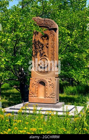 Khachkar, the sacred cross-stone on red volcanic tuff in Armenia Stock Photo