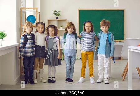 Portrait in the classroom of a small group of elementary school or kindergarten students. Stock Photo