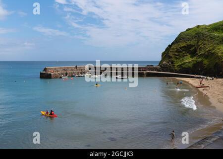 Gorran Haven Cornwall beach and harbour wall beautiful Cornish coast village south west England UK Stock Photo