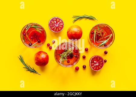 Cold cocktails in glasses with cranberry and blood orange grapefruit Stock Photo