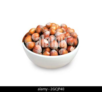 Hazelnuts in a bowl isolated on white background with clipping path Stock Photo