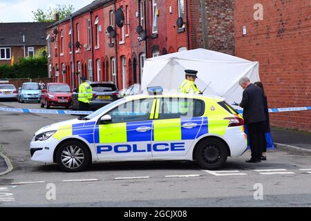 Manchester,UK, 9th August, 2021. Police cordon Friendship Ave, Manchester,UK. Greater Manchester Police statement: 'At around 10.20pm last night (Sunday 8 August 2021) police were called to Woodland Road, Manchester to reports of an attempted murder. Officers attended and established that a 63-year-old man had been struck by a Citroen C5 car and sustained serious injuries. The car used in the incident has since been recovered by officers and the man has been taken to hospital where he remains for treatment. Two men, aged 28 and 25, have been arrested.' Credit: Terry Waller/Alamy Live News Stock Photo