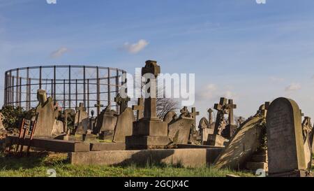 Gravestones and gasometer, Kensal Green Cemetery, Victorian gothic ...