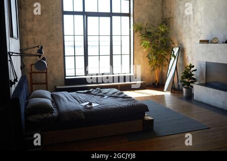 Background image of empty bedroom interior with modern loft design, copy space Stock Photo