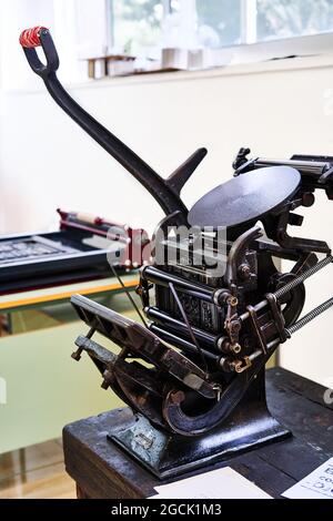Old typography printing machine with letter samples Stock Photo - Alamy