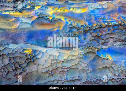 Textured background of solid rocky surface with layers of blue and brown colors Stock Photo