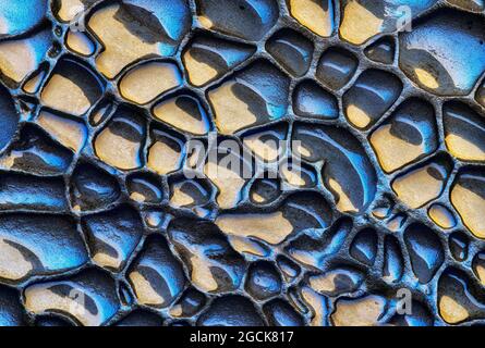 Rough textured background of rock sedimentary of blue and yellow colors with uneven surface Stock Photo