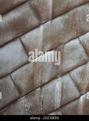 Background of weathered tiled wall or floor surface covered with dust and scratches Stock Photo