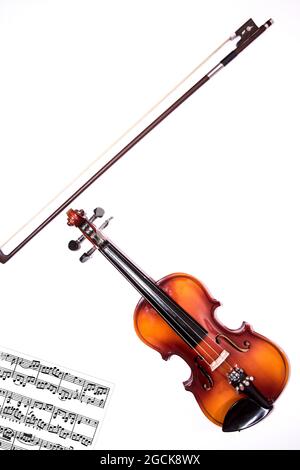 Front view of violin with Violin stick isolated on white background Stock Photo