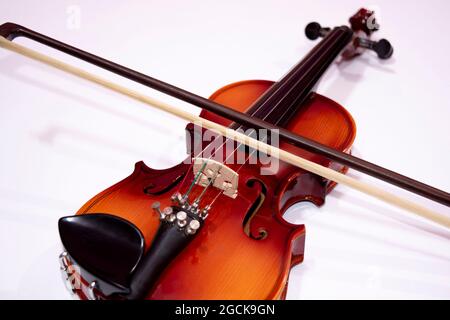 Front view of violin with Violin stick isolated on white background Stock Photo