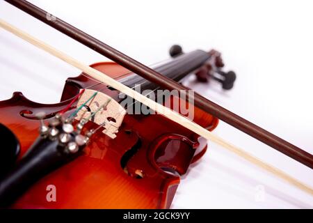 Front view of violin with Violin stick isolated on white background Stock Photo