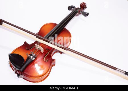 Front view of violin with Violin stick isolated on white background Stock Photo