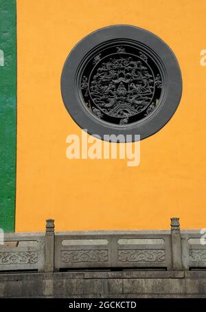 Lingyin Temple also known as the Temple of the Soul's Retreat in Hangzhou, China. Architectural detail of a circular window at this ancient temple. Stock Photo