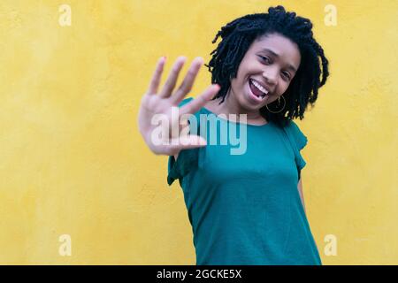 Portrait of young Woman dancing outdoors Stock Photo