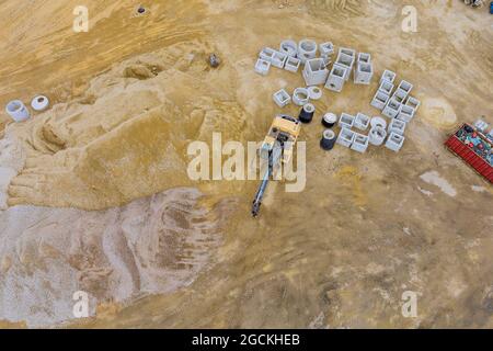 Concrete pipes to construct drainage systems on large cement drainage pipes for industrial building construction, selective focus. Stock Photo