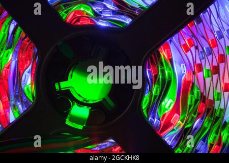 Rolled LED strip lights glow in the dark, close up photo with soft selective focus Stock Photo