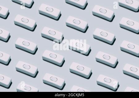 Conceptual shot of an electric switch button isolated on grey background Stock Photo
