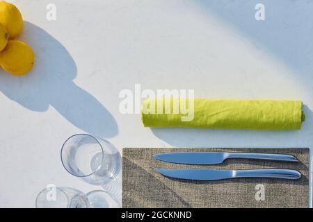 Table set up ready for food and drinks at outdoor high cuisine restaurant Stock Photo