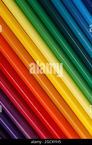 Colored gradient of pencils. Solid abstract background with color tone transition. Diagonal direction of lines. Stylish back. Stock Photo