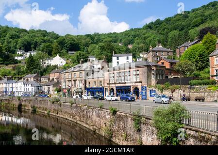 Matlock bath town centre with shops and cafes alongside the river Derwent North Parade Derbyshire England UK GB Europe Stock Photo