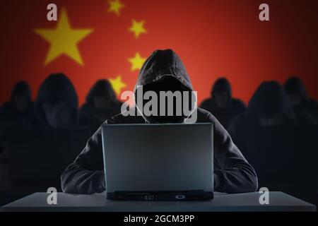 Many chinese hackers in troll farm. Privacy and security concept. Stock Photo