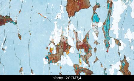 texture of peeling paint several layers of light blue and brown color spots Stock Photo