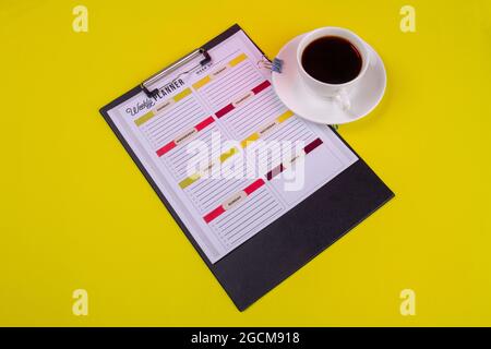 Clipboard with cup of strong coffee in a white cup. Stock Photo