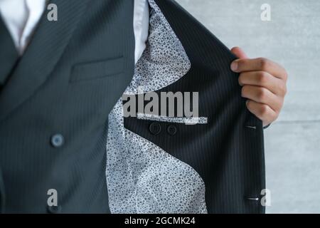 Inner pocket of man's suit with hand. High quality photo Stock Photo
