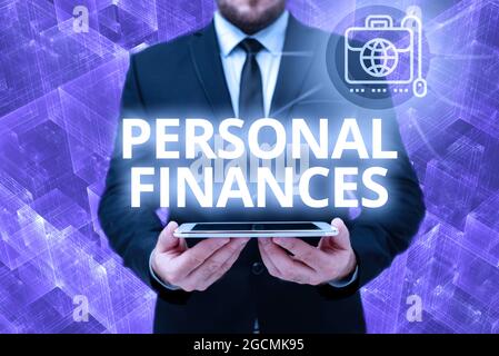 Hand writing sign Personal Finances. Business approach the activity of managing own money and financial decisions Man In Office Uniform Holding Tablet Stock Photo