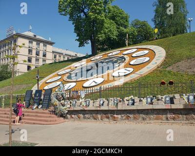 Kiev, Ukraine-April 29, 2018: Photos of victims of the protests on the Alley of the Heavenly Hundred in Kiev, Ukraine. Woman taking photo of the Heave Stock Photo