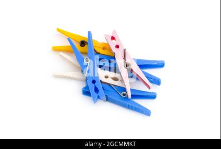 A bunch of colorful clothespins on isolated white background Stock Photo