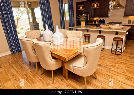 Wooden Dining Area Table With Modern Granite Counter Kitchen Stock Photo