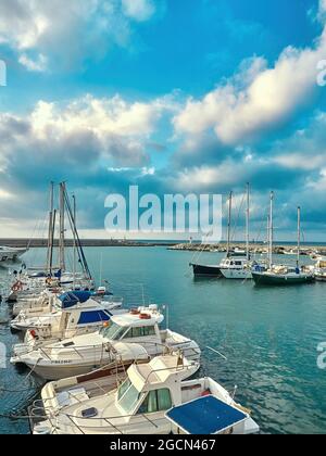 Estepona, Spain / Spain - March 2018: Port of Estepona full of boats with blue sky full of clouds Stock Photo