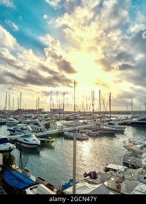 Estepona, Spain / Spain - March 2018: Port of Estepona full of boats with blue sky full of clouds Stock Photo