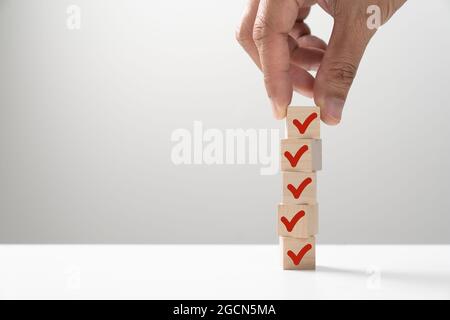 Red tick marking on checklist Stock Photo