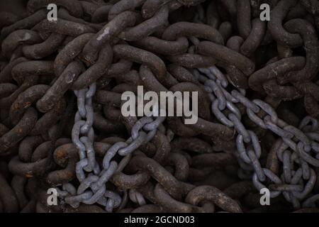 High angle shot of rusted and old chains tangled together Stock Photo