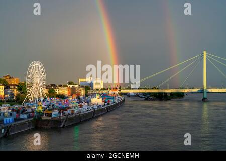 Kirmes Happy Colonia, Corona-compliant funfair at the Deutzer Werft, on the Rhine, Ferris wheel, Severinsbrücke, , Rhine, Rainbow, a temporary amuseme Stock Photo